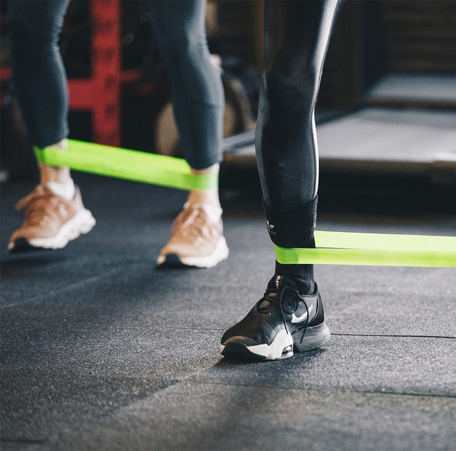Studio Info 1 people exercising with bands at the gym